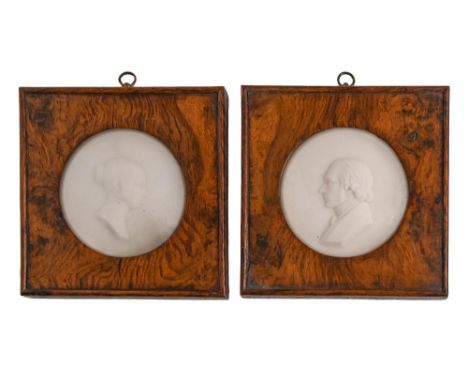 A pair of wax portrait medallions of a nobleman and lady, 19th c,&nbsp; 85mm diam, in square burr oak frames with oak surroun