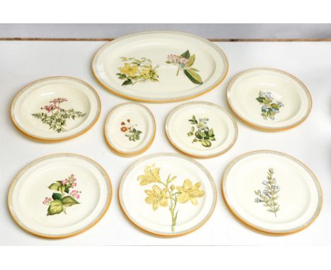 A Wedgwood Queen's Ware dinner service, 1874, printed and painted with botanical plants in looped sepia border and ochre ring