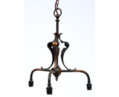 An English Art Nouveau oxidised brass three light chandelier, early 20th c, with downcurved branches and whiplash appliques, 