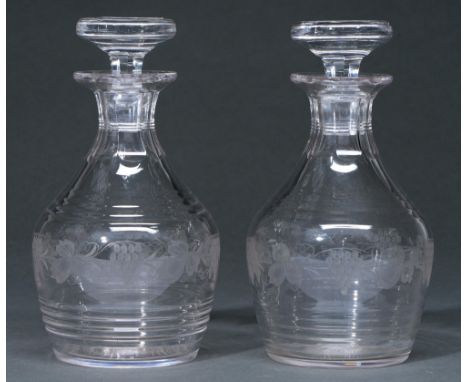 A pair of glass decanters and stoppers, first half 20th c, wheel engraved with band of grapevines, 22.5cm h Good condition