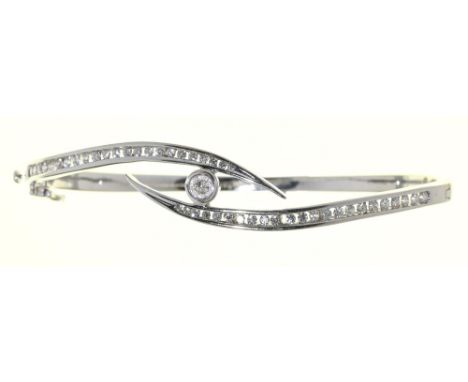 A| diamond bangle,&nbsp; in 18ct white gold, 59mm (internal), London 2004, 15.5g Good condition