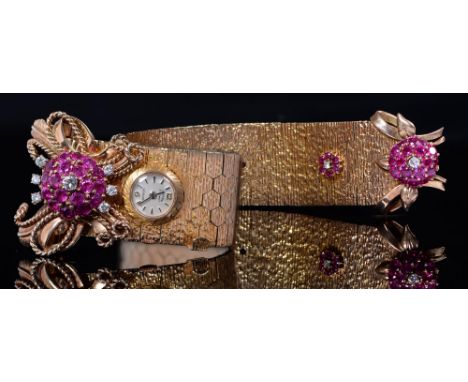 A mid-century ruby, diamond and 9ct gold cocktail watch, c1950, the textured strap inset with 10mm dial signed Josarn, 24.5cm