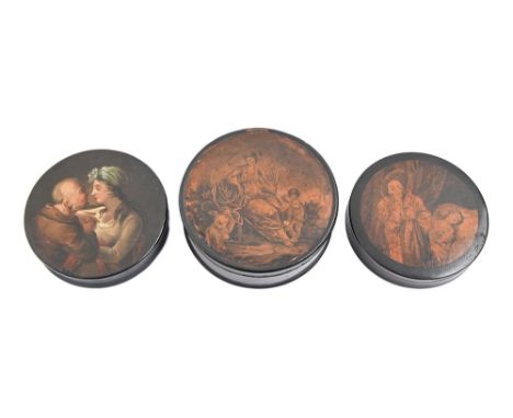 A papier mache snuff box painted with a couple, another with printed lid and another, larger, 95-111mm diam (3) 