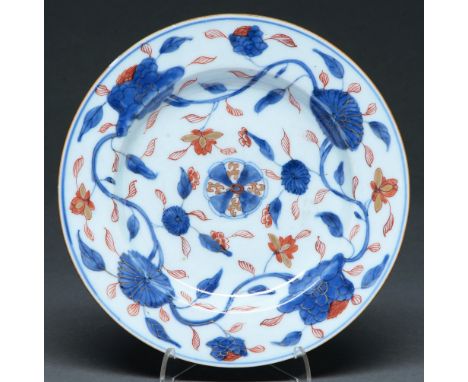 A Chinese Imari plate, 18th c,&nbsp;painted with peony meander in brown edged rim, 22.5cm diam Light wear otherwise good cond