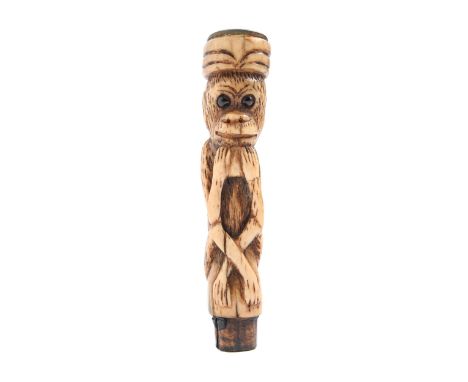 A carved bone cane handle&nbsp;&nbsp;in the form of a monkey, late 19th c,&nbsp;with black bead eyes, agate set cap, 10cm h O