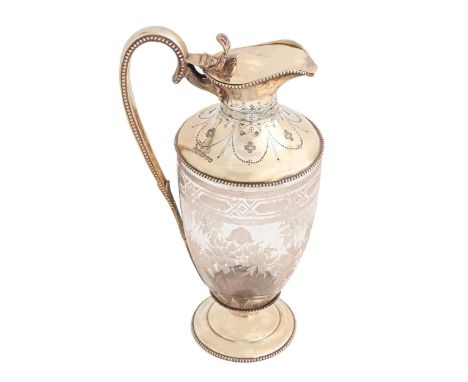 A Victorian silver mounted glass claret jug, of shield shape, engraved with festoons within beaded rims, 28cm h, by William a