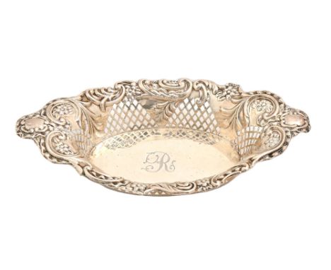 A Victorian silver dish, engraved with initial R, the sides pierced with trellis and die stamped with flowers and C-scrolls, 
