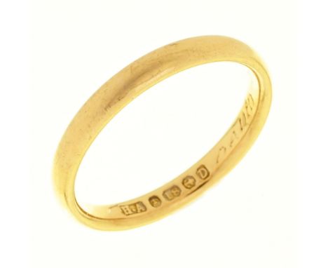 A 22ct gold wedding ring, Birmingham 1989, 11.2g, size K½ Wear consistent with age