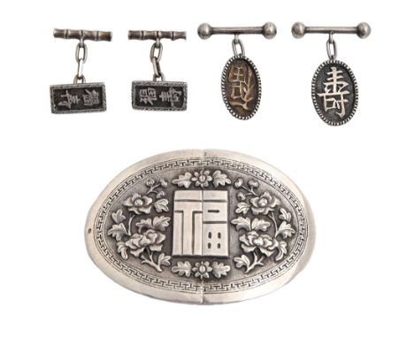 A Chinese oval silver waist clasp and two pairs of cufflinks, early 20th c, with applied repousse floral decoration or callig