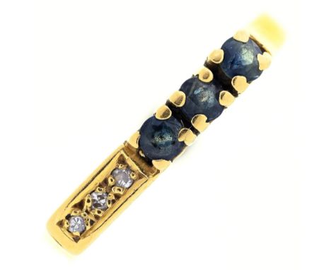 A sapphire and diamond ring, illusion set in gold marked 18ct, 2.9g, size O 