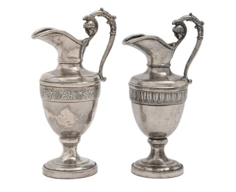 A pair of Continental miniature silver ewers, 19th c, of shield shape, the handle terminating in the head of Minerva, 13.5cm 