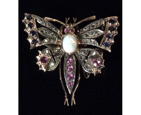 A VICTORIAN 14CT GOLD, DIAMOND, RUBY, SAPPHIRE, EMERALD AND OPAL BUTTERFLY BROOCH The central cabochon cut opal flanked by ro