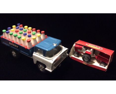TRI-ANG, 'HI-WAY', A VINTAGE BLUE AND WHITE ENAMELLED TINPLATE MODEL OF A MILK WAGON Complete with multicoloured plastic bott