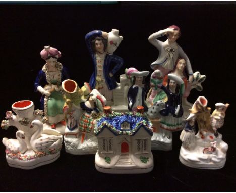 STAFFORDSHIRE, A COLLECTION OF 19TH CENTURY POTTERY FIGURES Including a maiden and beau looking out to sea, a gentleman stood