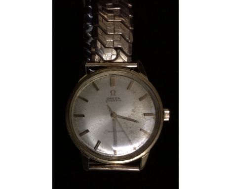 OMEGA, SEAMASTER, A GENTLEMEN'S GOLD PLATED WRISTWATCH The circular champagne tone dial with gilt numerals, on an elasticated