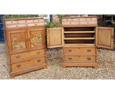 A RARE PAIR OF 19TH CENTURY GOTHIC INSPIRED PINE DWARF LINEN PRESSES With chinoiserie decoration, the caddy tops fitted with 
