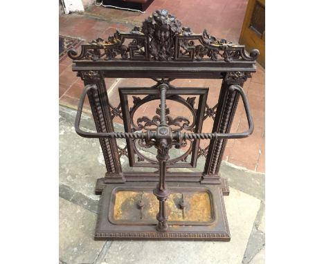 A VICTORIAN COALBROOKDALE DESIGN STICK STAND With central facial mask surrounded by foliage.