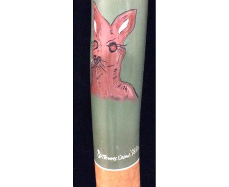 JIMMY CROW, AUSTRALIAN, A LATE 20 TH CENTURY WOOD DIDGERIDOO Hand painted with kangaroos on a light green ground, signed 'Jim