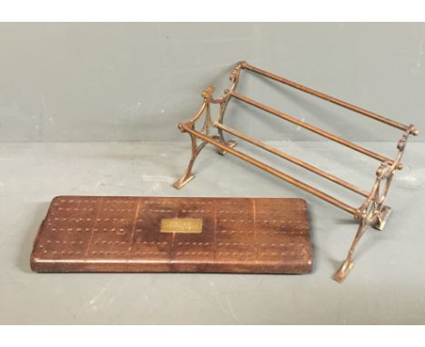 AN EDWARDIAN BRASS DESK TO BOOK TROUGH  Along with a Victorian brass and mahogany cribbage board.