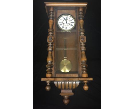 A 19TH CENTURY WALNUT CASED VIENNA REGULATOR CLOCK The dial painted with a Roman numeral chapter ring and eight day movement,