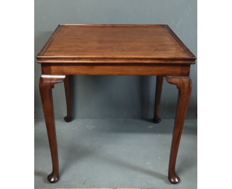 A 19TH CENTURY MAHOGANY OCCASIONAL CARD TABLE The reversible top concealing a green baize playing surface, with wells raised 