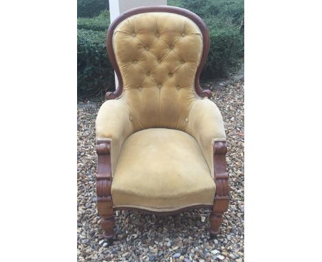 A VICTORIAN MAHOGANY FRAMED SPOONBACK ARMCHAIR CHAIR In mustard velvet button back upholstery.  