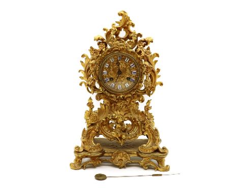A French ormolu mantle clock,19th century, the embossed gilt dial with Roman tablet numerals and moon hands, the movement wit