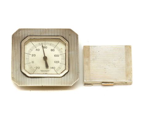 A silver compact, London, 1943, with a gilt thumbpiece, interior loose, the cover mounted with a mirror, 7cm x 6cm and a silv