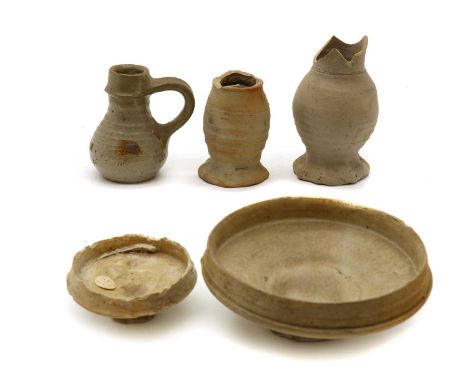 Two Siegburg stoneware drinking cups,15th/16th century, partially glazed, 12.5 and 7.5cm diameter;two Siegburg jugs, extensiv