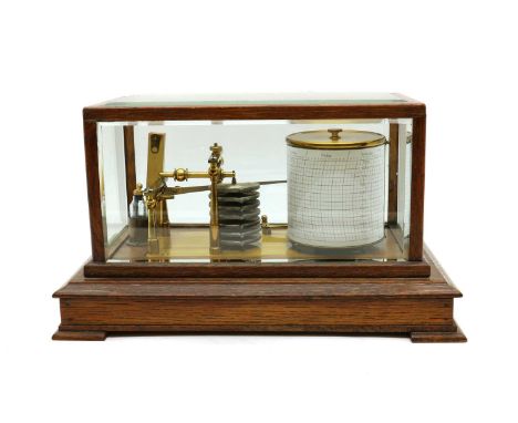 An oak cased barograph, c.1930, with a polished brass mechanism, bevelled glass sides and chart drawer,36cm wide23cm deep21cm