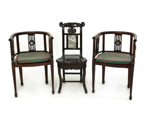 A pair of Chinese blackwood barrel-backed armchairs, 19th century, with slatted sides and backs, each section inlaid to the c