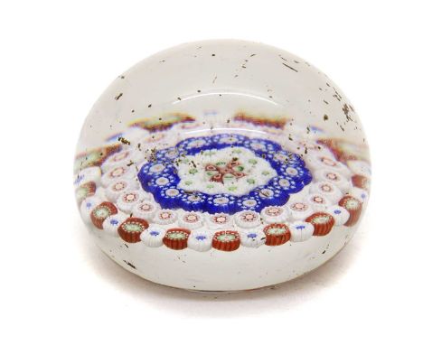 A Baccarat glass paperweight,mid-19th century, with concentric millefiori decoration,6.3cm diameterCondition ReportDeep scrat