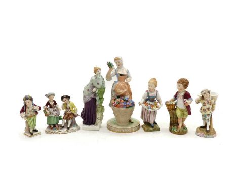 A collection of Continental porcelain figures,comprising a Dresden figure, modelled as a lady before a basket of flowers, und