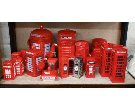 A collection of ceramic and metal telephone boxes, as teapots, money-boxes, clocks, condiments etc