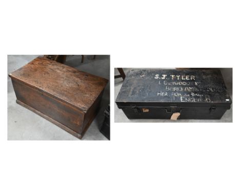 An antique elm coffer with hinged top, 79 c 44 c 35 cm h to/w a black steel military 'S J Tyler' uniform trunk (2)