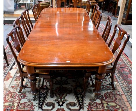 A large Victorian style mahogany extending dining table, the wind action extending to accept three additional leaves, raised 