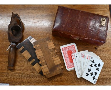 A Black Forest carved wood 'squirrel' nut-cracker to/w two bezique scoreboards and a leather playing cards box from Finnegans