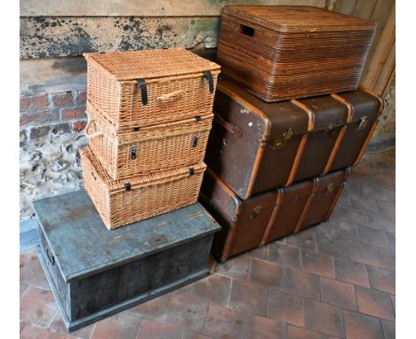 Three various wicker hampers, to/with a wicker box seat, two vintage brass bound trunks and a stained pine trunk (7)