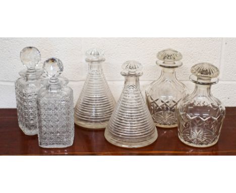 A pair of 19th century step-cut conical ship's decanters with star-cut mushroom stoppers 22 cm high, to/w two other pairs of 