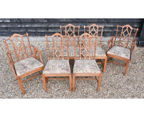 A set of six vintage beech framed dining chairs in the Chippendale manner, with machined floral tapestry seats, comprising tw