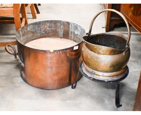 An large antique hammered copper cooking pot/planter with brass handles, 46 cm diameter c/w a brass coal scuttle and wrought 