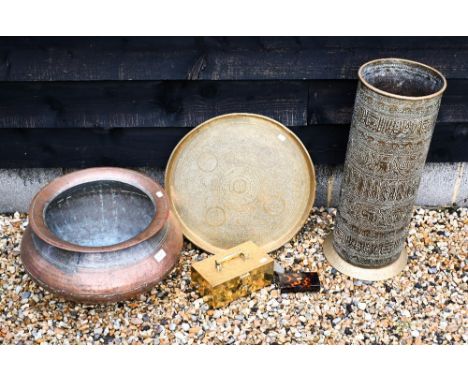 An antique Indo-Persian tinned and hammered copper cooking pot to/w embossed and engraved brass cylindrical stick stand, an e