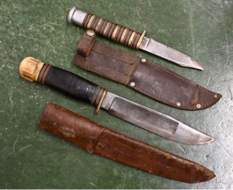 An antique 'Invicta' Hunting Knife by E.M. Dickinson of Sheffield with 15 cm fullered blade, brass hilt, leather disc grip an