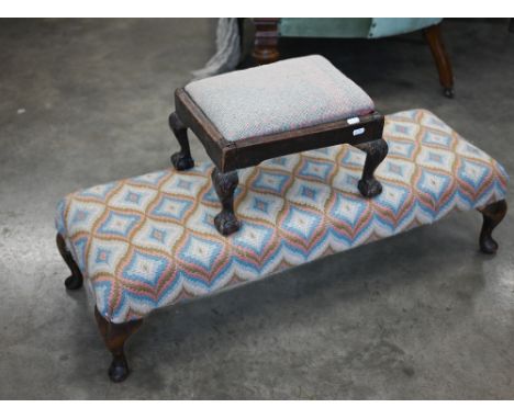 An antique oak framed longstitch covered double footstool on cabriole legs, 94 cm w x 30 cm d x 25 cm h to/w smaller footstoo