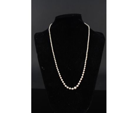 A graduating pearl necklace with 18ct white gold and platinum clasp set with small diamond