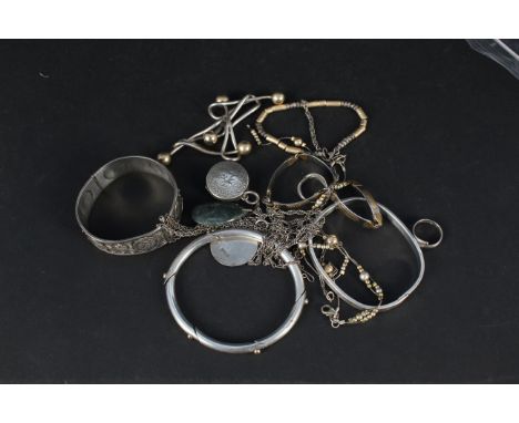 A mixed lot of silver and white metal jewellery including bangles, necklaces, rings etc