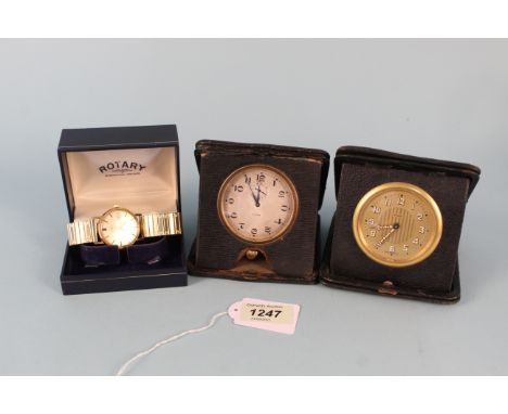 A Cyma travelling clock and another German 8 day example together with a gold plated Rotary quartz wristwatch