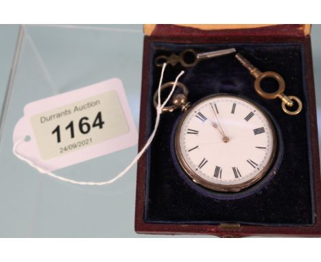 A silver cased pocket watch of small proportions in case