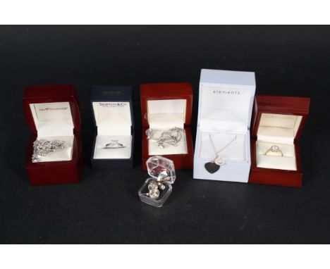 A collection of silver and white metal jewellery including matching pendant, earring and ring sets