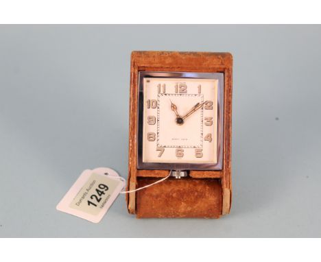 A c1950's leather cased travelling clock by LeCoultre, marked 'Eight Days'